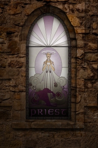 (c) Disciplinary Action - Stained Class: The Priest, stained glass